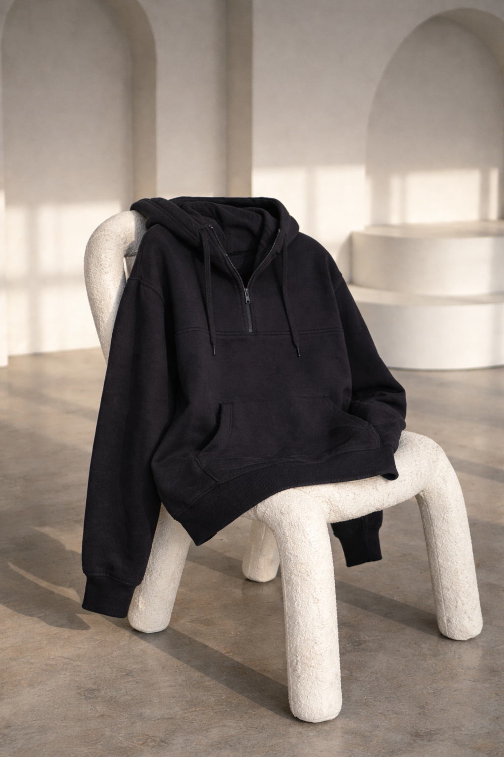 247calm hoodie hanging on a chair 